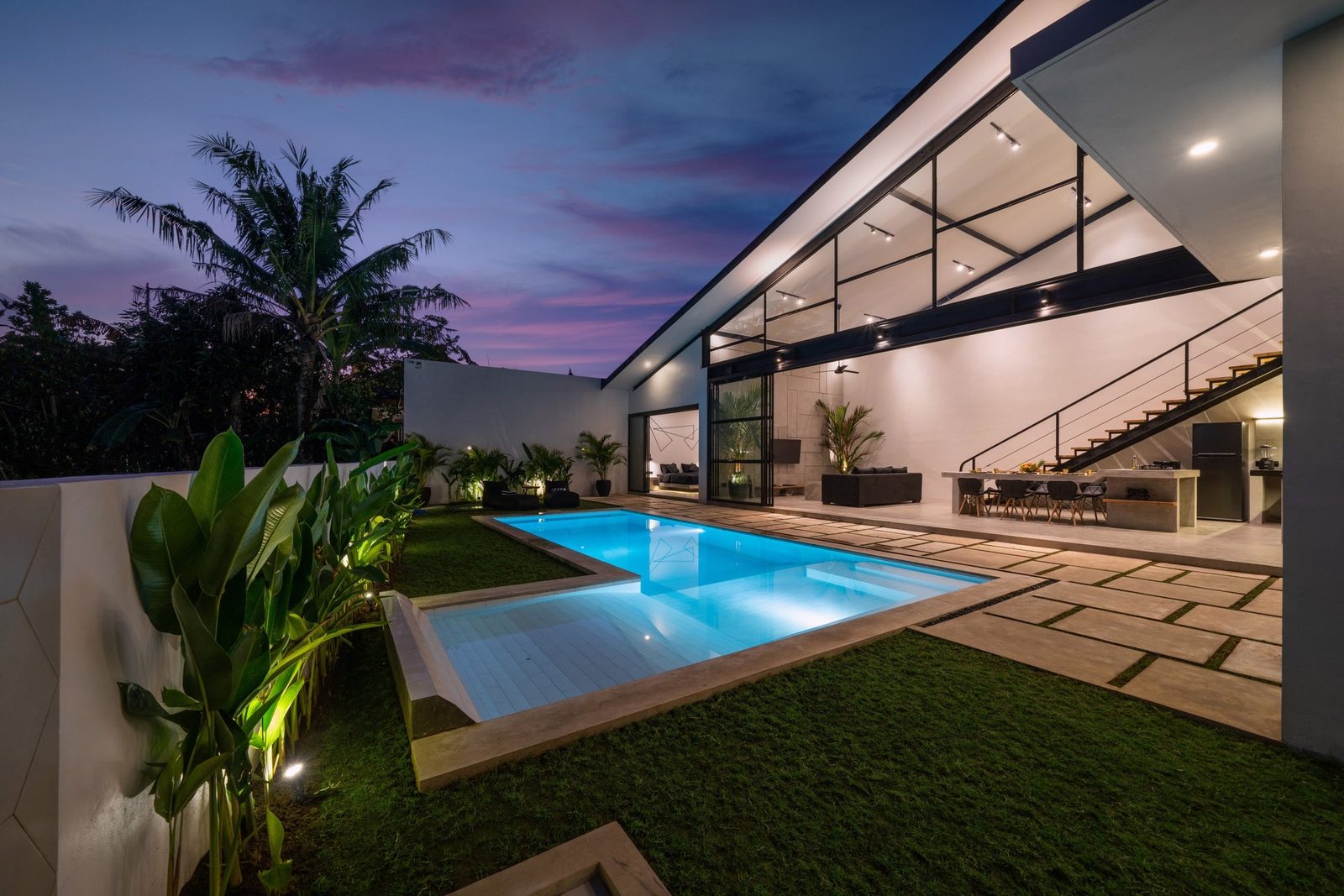 Twilight real estate photo — warm glow from interior lights